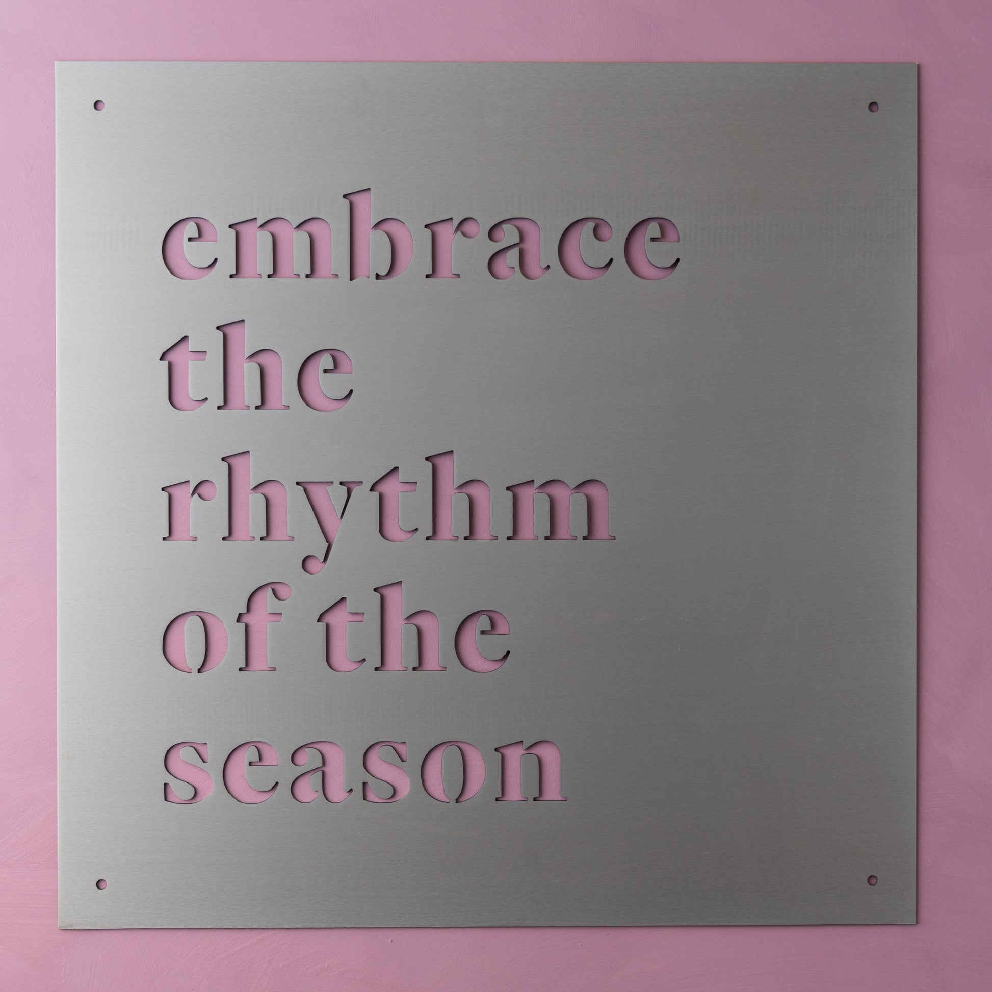 metal wall sign that reads "embrace the rhythm of the season"